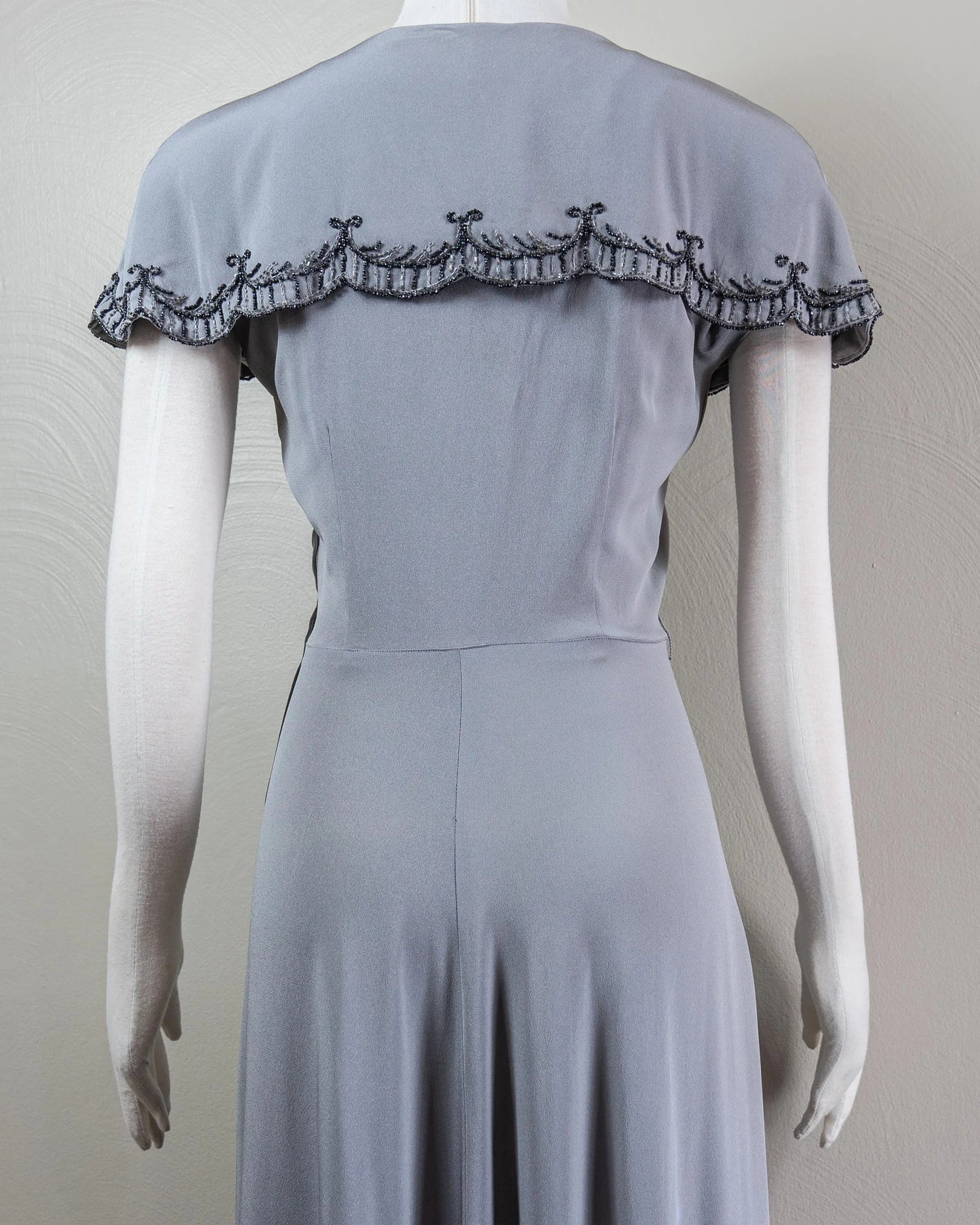 Vintage-Inspired Satin Evening Dress with Beaded Capelet Collar and Flowing Skirt