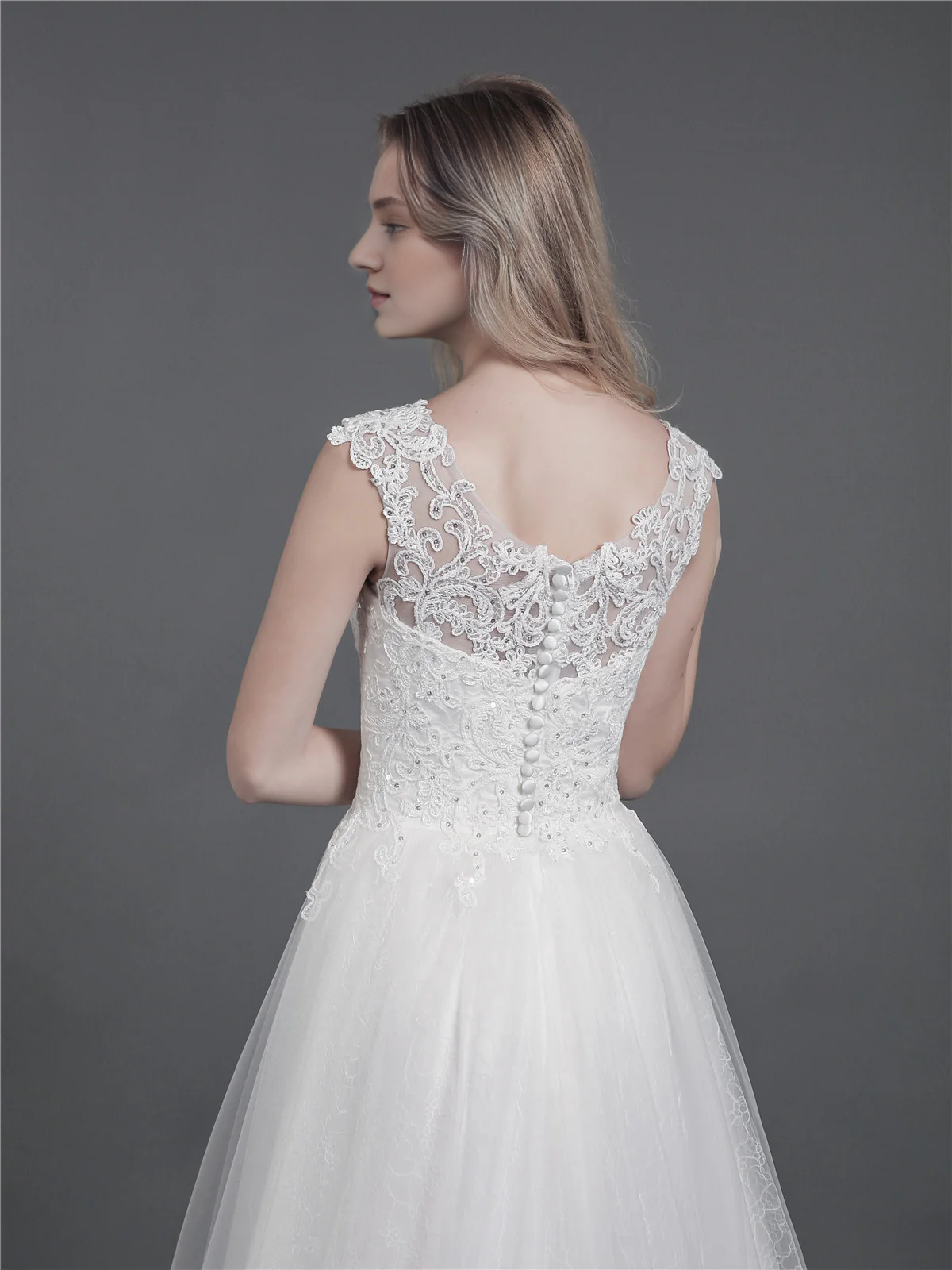 Lace wedding dress with drag and shoulder straps