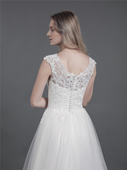 Lace wedding dress with drag and shoulder straps