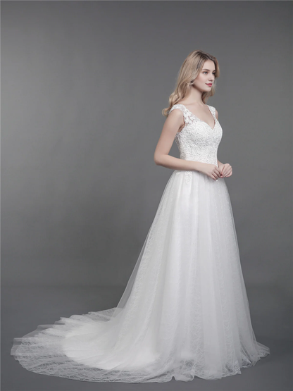 Lace wedding dress with drag and shoulder straps