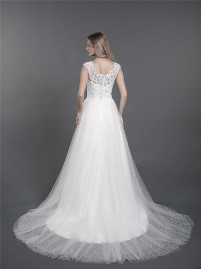 Lace wedding dress with drag and shoulder straps