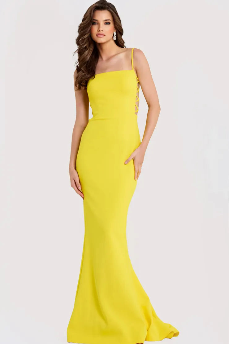 Bold yellow crepe evening dress with spaghetti straps, square neck, lace-up side cut-outs, and mermaid skirt with train