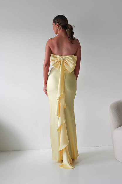 Bright Yellow Strapless Mermaid Prom Dress with Dramatic Back Bow