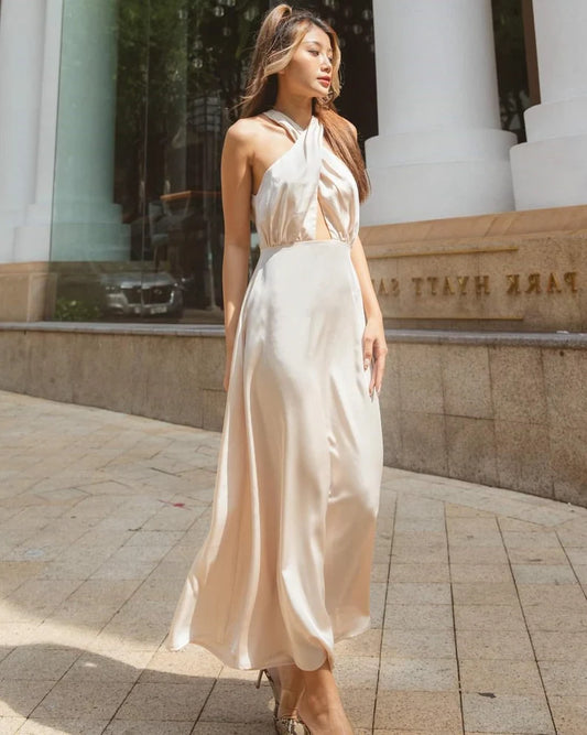 Chic Champagne Satin Halter Evening Dresses with Twist Front, Keyhole Back, Cutout Waist and Flowing Midi Silhouette Formal Gown
