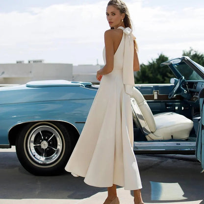 Chic Halter Evening Dress with Back Bow Tie, Open Back and Flared Midi Skirt