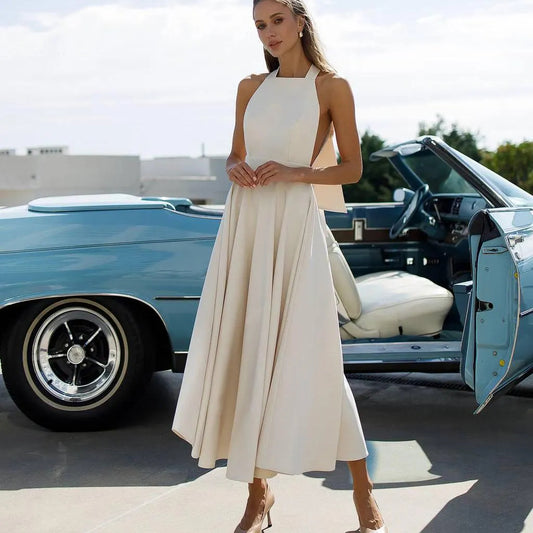 Chic Halter Evening Dress with Back Bow Tie, Open Back and Flared Midi Skirt