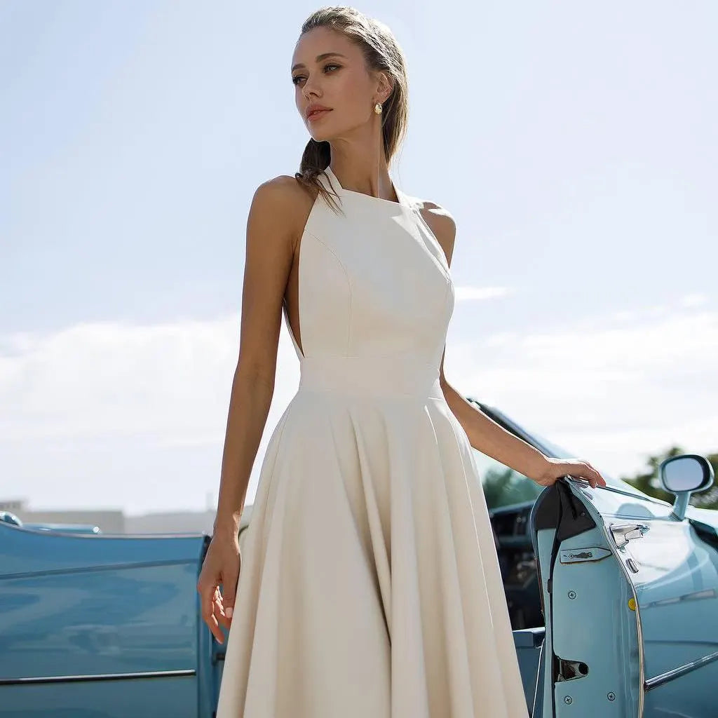 Chic Halter Evening Dress with Back Bow Tie, Open Back and Flared Midi Skirt