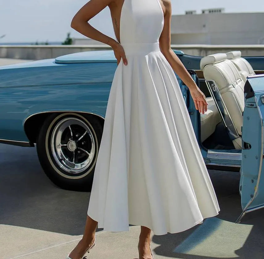 Chic Halter Evening Dress with Back Bow Tie, Open Back and Flared Midi Skirt