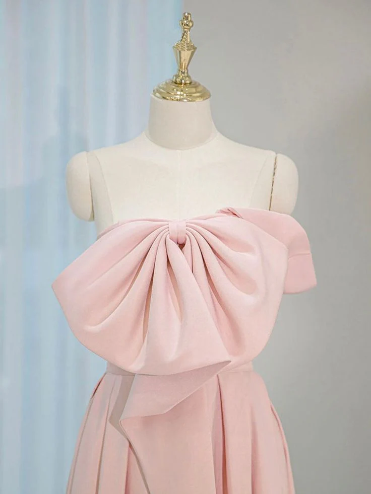 Back view of pink ball gown showing lace-up corset closure.