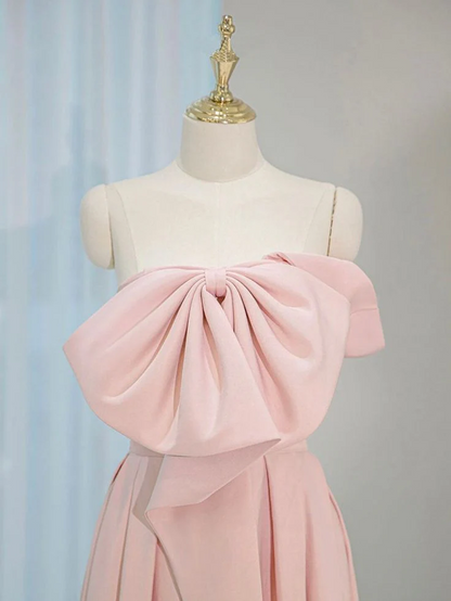 Back view of pink ball gown showing lace-up corset closure.
