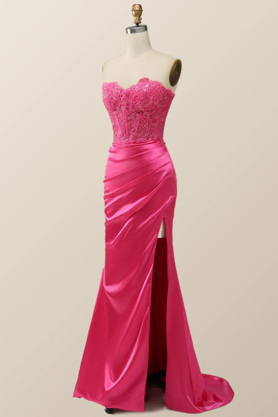 Side view of a model showcasing the high slit on a beaded mermaid dress.