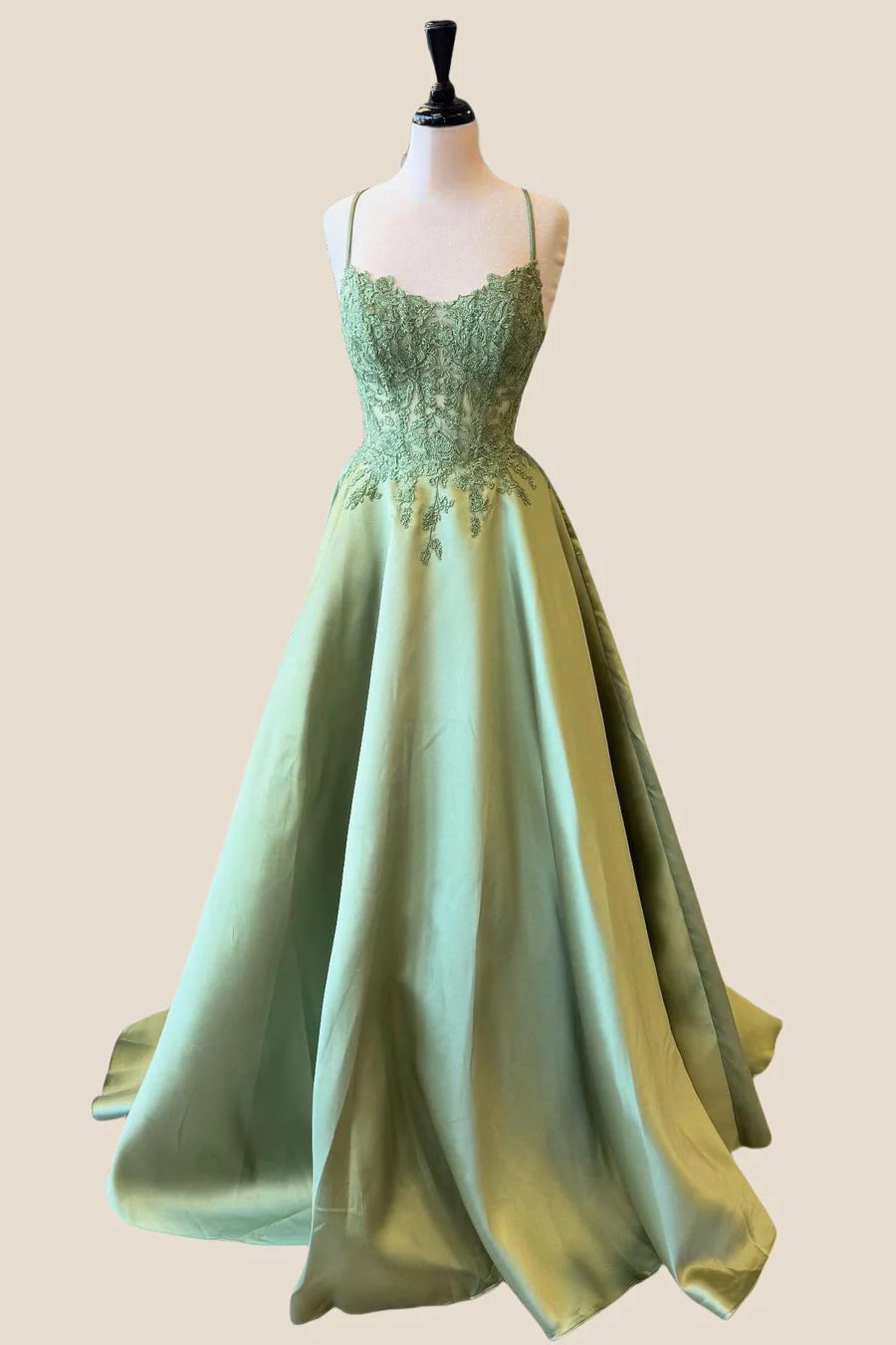 Model showcasing a floor-length satin A-line evening gown.