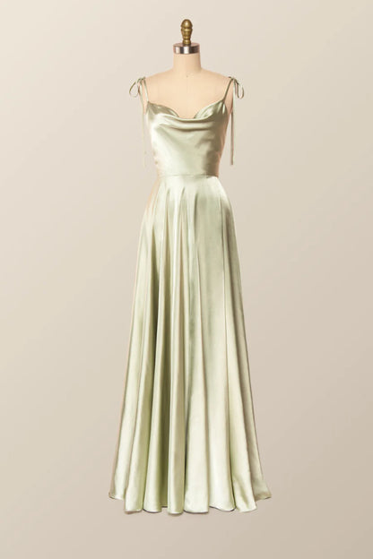 Model walking in a flowy satin A-line evening gown, showcasing its drape.