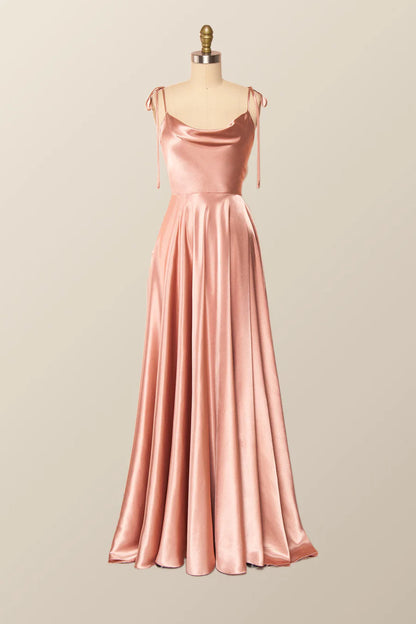 Model posing in a lustrous satin A-line evening gown for formal events.