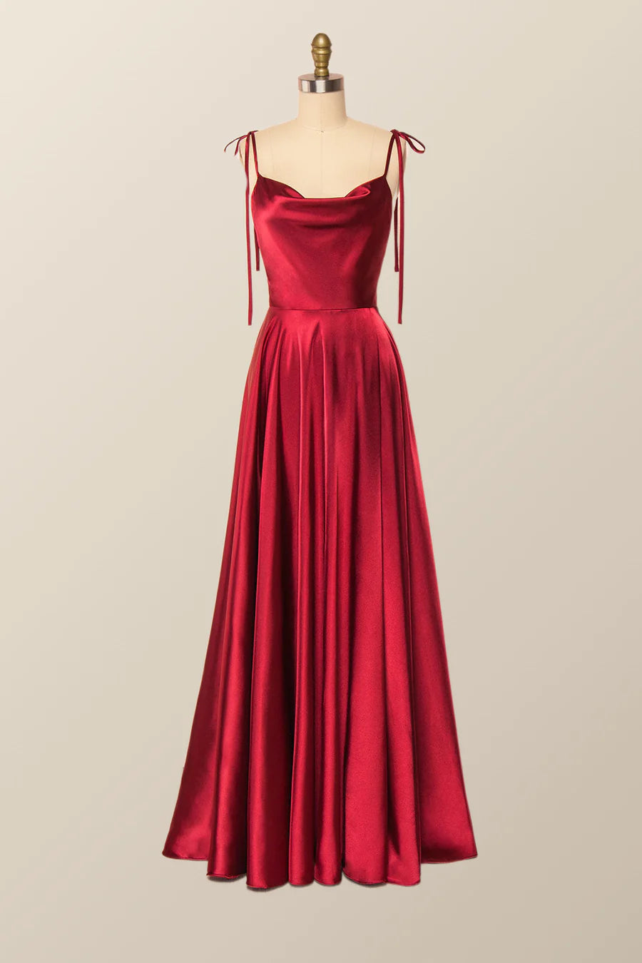 Full-length view of an elegant satin A-line cowl neck evening gown.