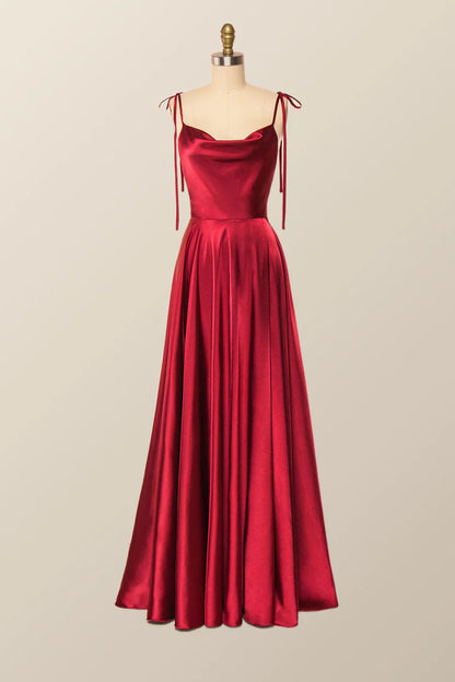 Full-length view of an elegant satin A-line cowl neck evening gown.
