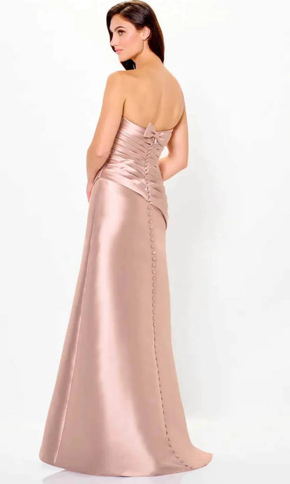 Back view of elegant ruched satin A-line gown with button closure and bow detail.