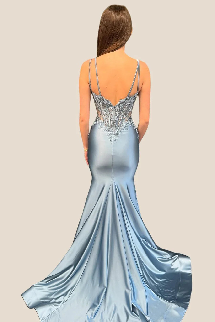 Side view of elegant mermaid gown, highlighting the flowing satin train.