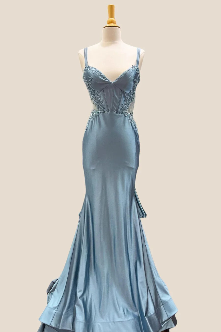 Full length view of the elegant satin mermaid evening dress.