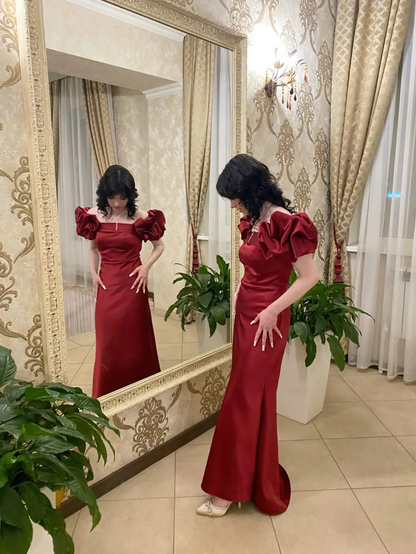 Close-up of the satin off-shoulder neckline and puff sleeves.