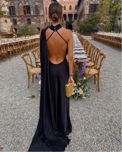 Side view of elegant satin mermaid prom dress showing floor-length skirt.