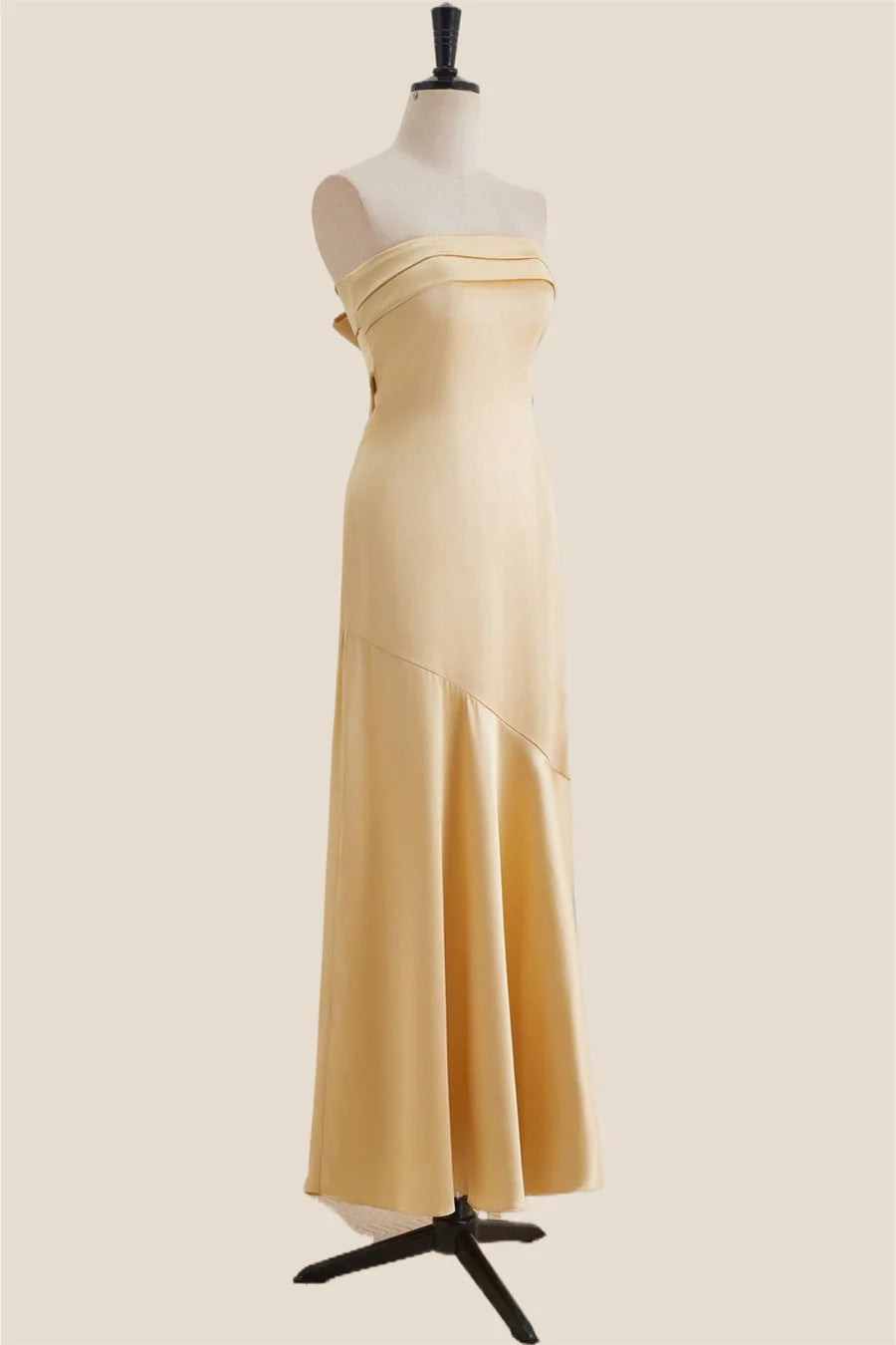 Back view of the satin mermaid dress, highlighting the large bow detail.