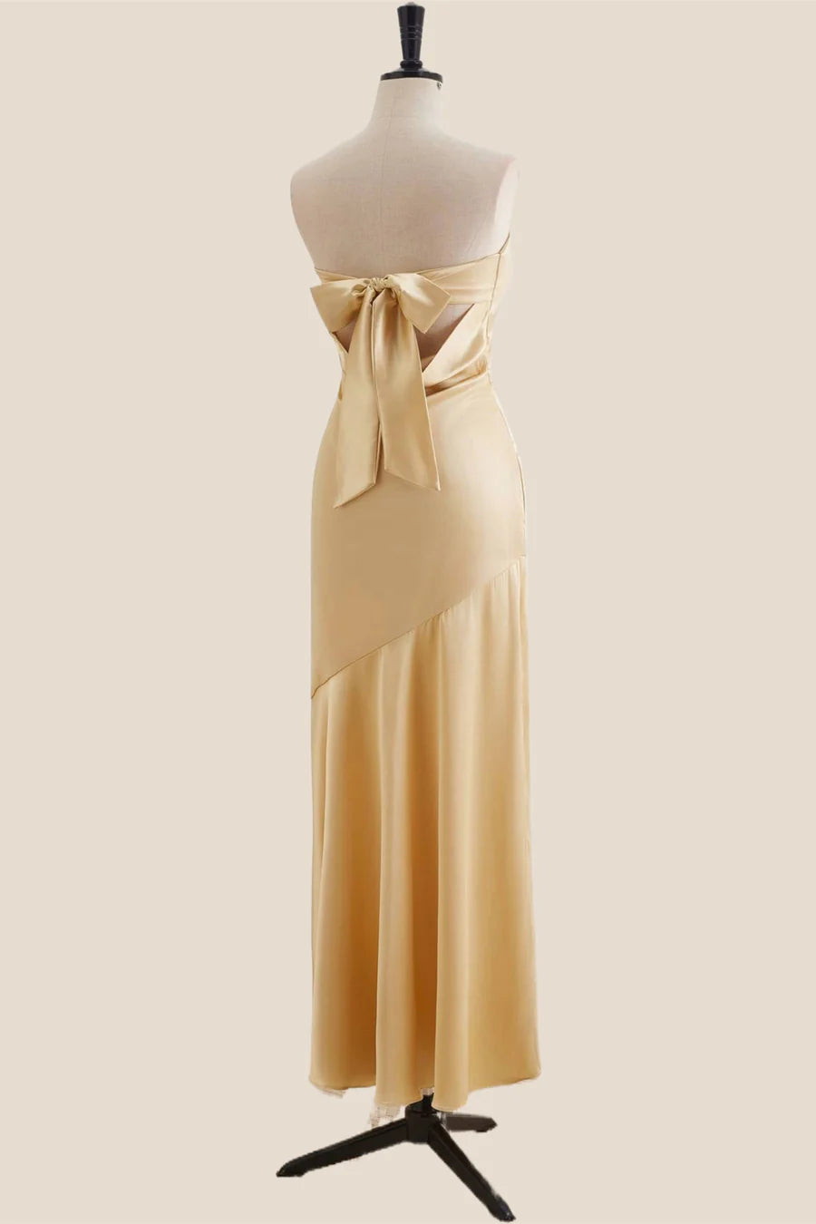 Side profile of the strapless satin mermaid gown.