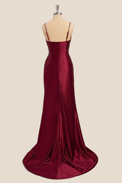 Close-up of sweetheart neckline and sparkling rhinestone straps on satin dress.