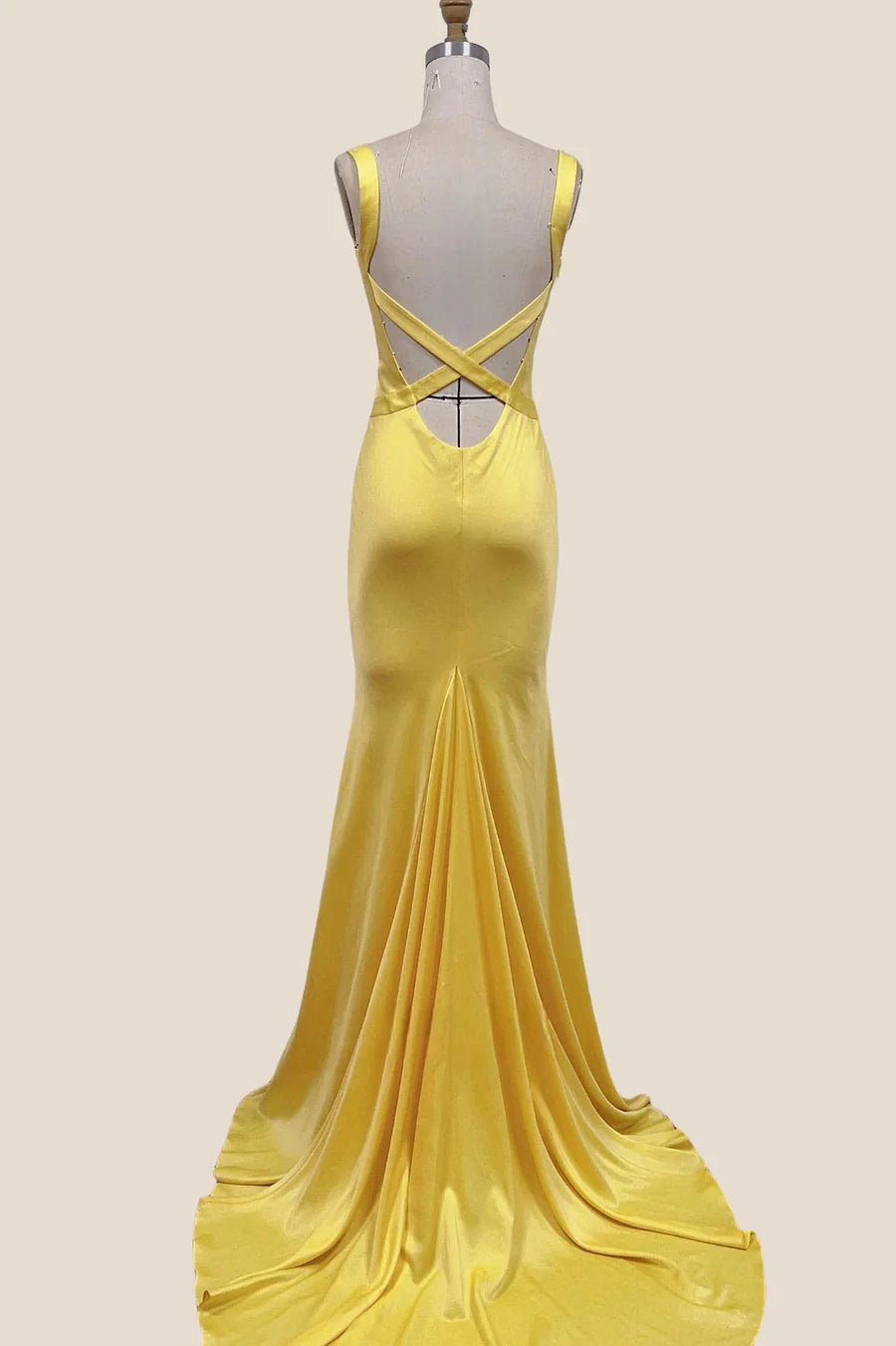 Front view of a V-neck sleeveless satin mermaid evening dress.