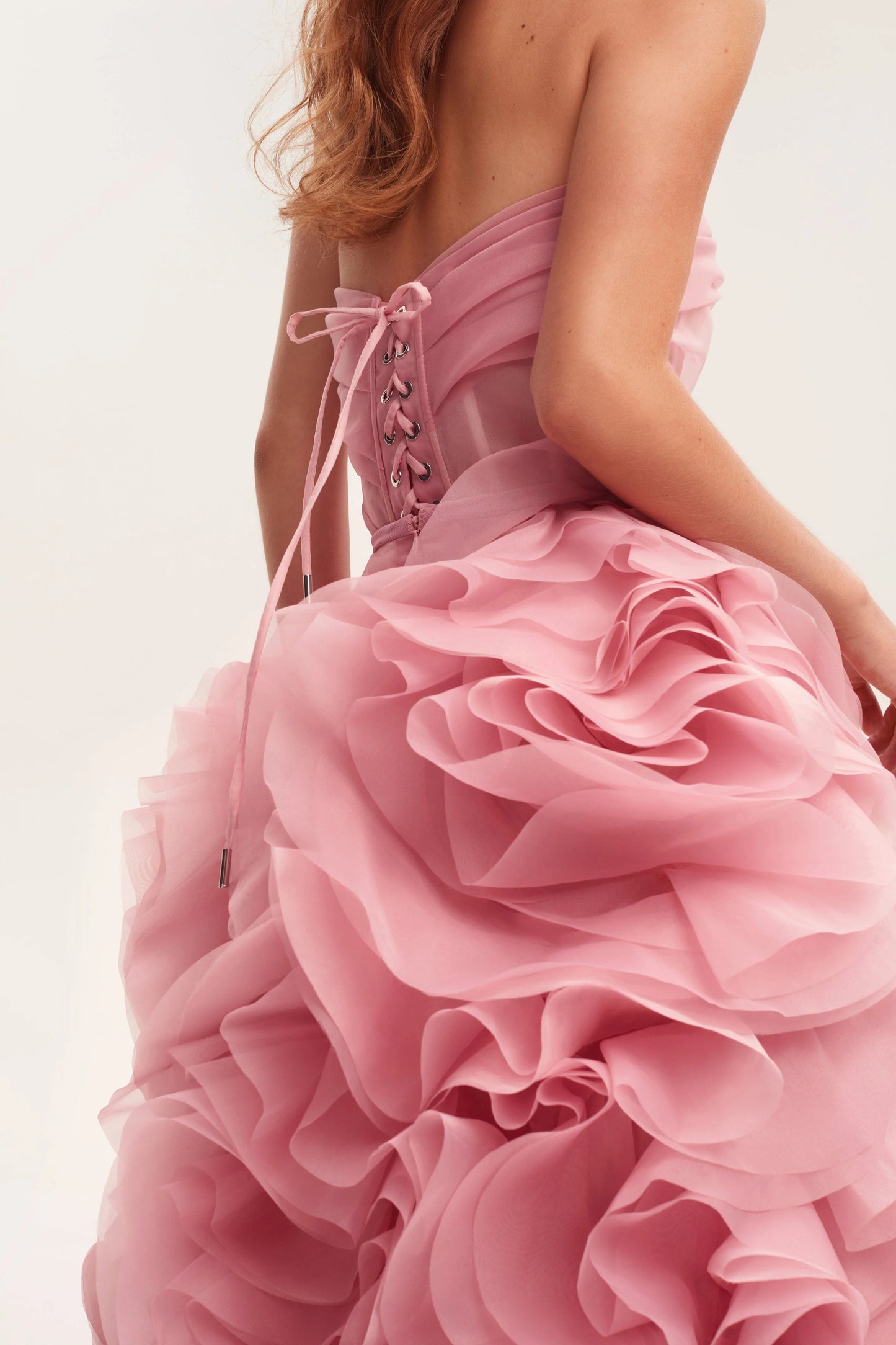Evening Dress with Strapless Neckline, Sheer Corset Bodice and Dramatic Ruffled Skirt