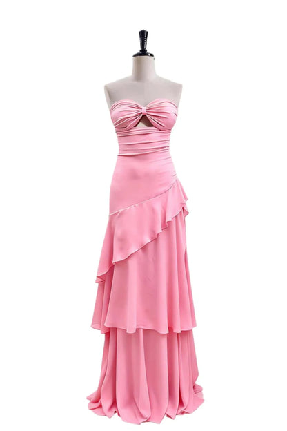 Close-up of the strapless keyhole-twist neckline on the evening dress.