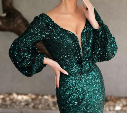 Elegant floor-length sequin gown with bishop sleeves and V-neck.