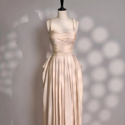 Glamorous Champagne Satin Evening Dress with Ruched Bodice, Draped Skirt and Convertible Straps