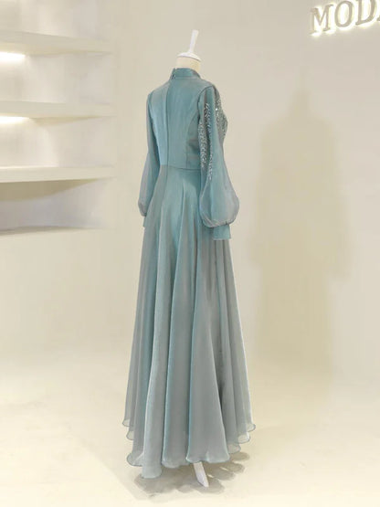 High Neck Evening Dress with Sheer Puffed Sleeves, Beaded Embroidery and Flowing Skirt