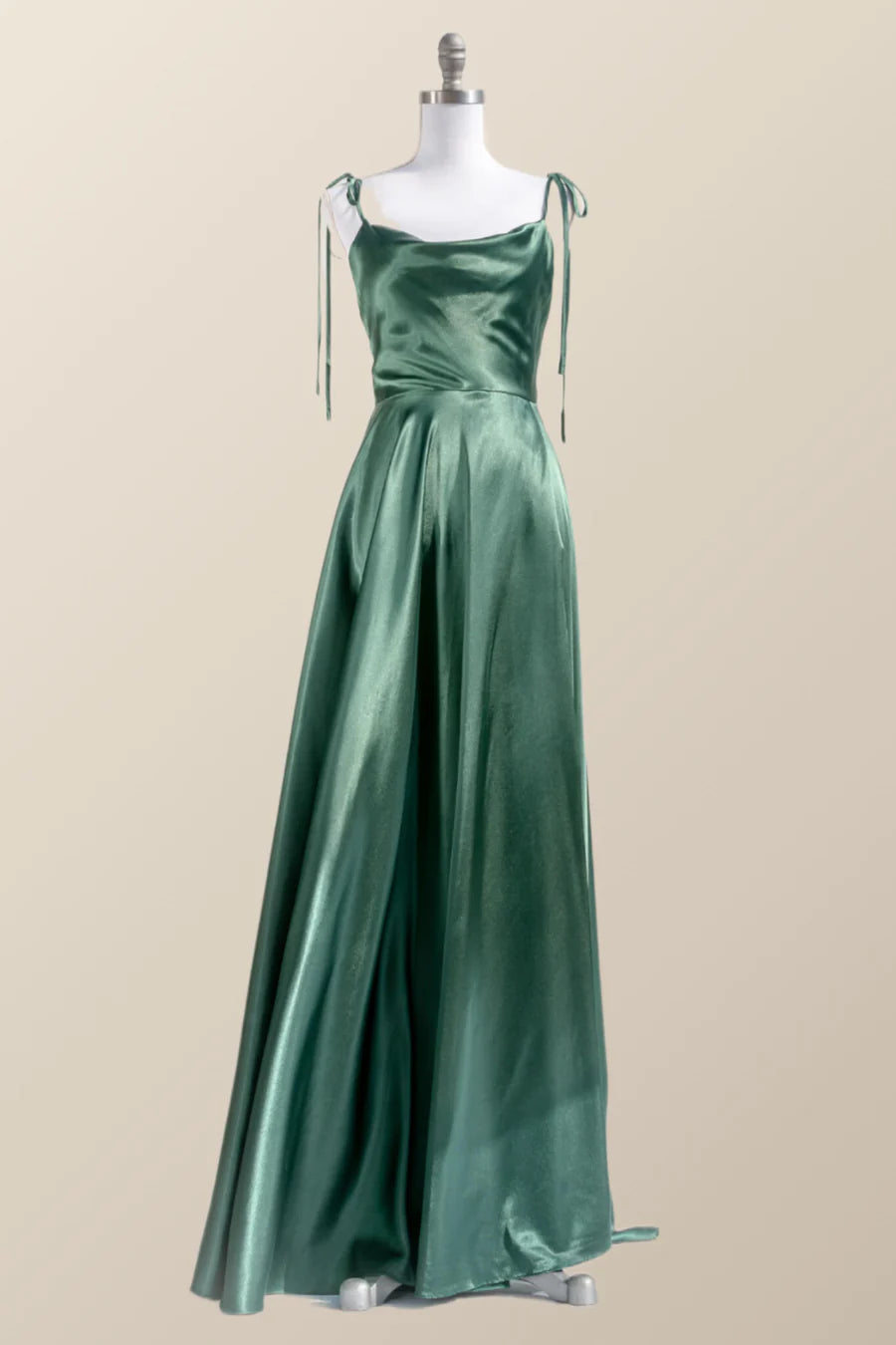 Back view of a woman in a satin gown showing low back and tie straps.