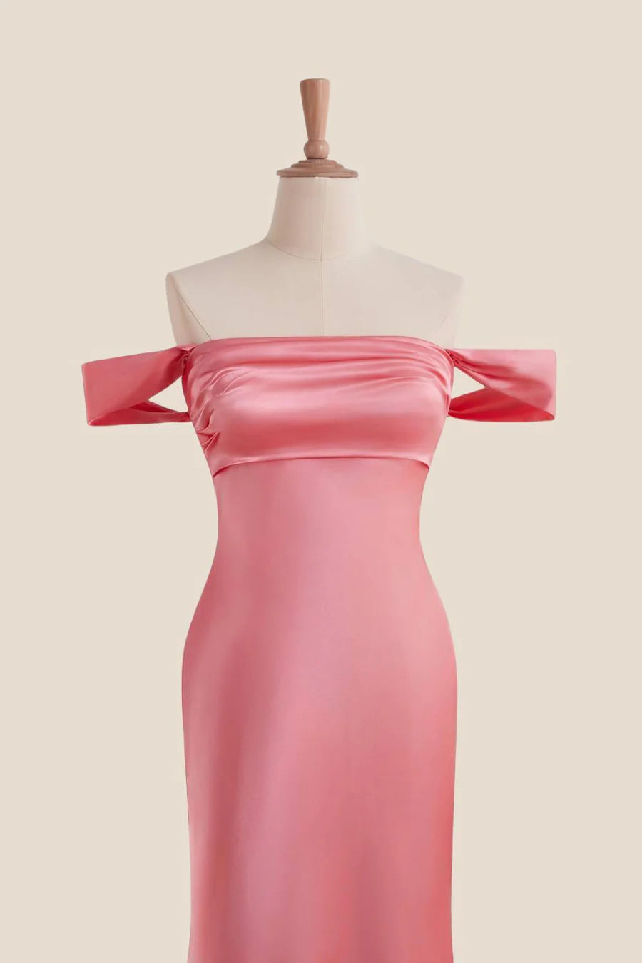 Close-up of the satin off-shoulder gown bodice with bow sleeves and ruched bust.
