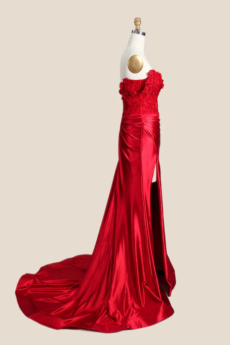 Back view of the lustrous satin mermaid evening dress, showing the ruched detail and sweeping train.