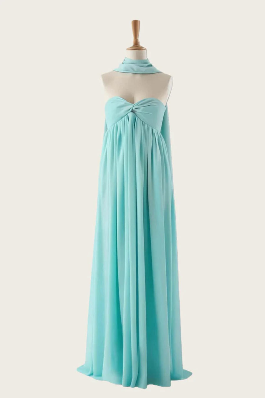 Full-length view of a model posing in an elegant satin mermaid evening dress.