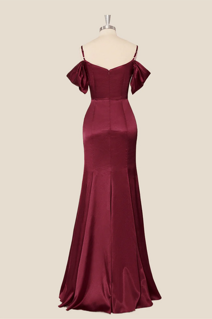 Back view of a lustrous satin mermaid evening dress, showing the floor-length hem.