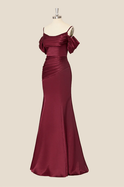 Close-up of the ruched bodice and sweetheart neckline of a satin evening dress.