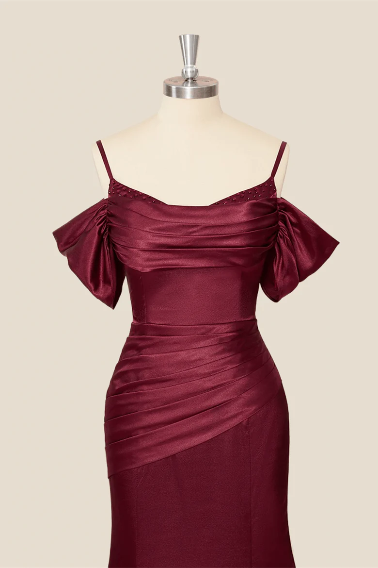 Full-length view of a lustrous satin mermaid evening dress, showcasing the off-shoulder straps.