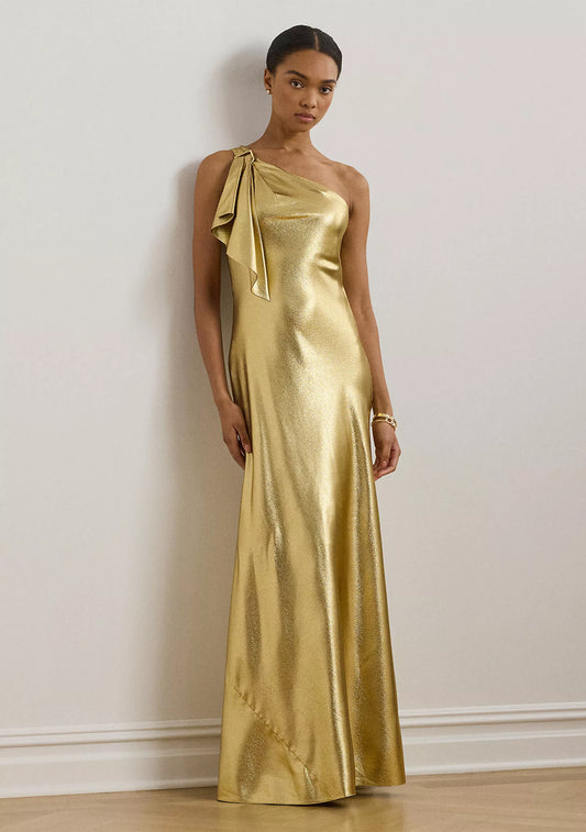 Luxurious one shoulder metallic evening gown with bow detail and floor-length skirt
