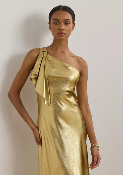 Luxurious one shoulder metallic evening gown with bow detail and floor-length skirt