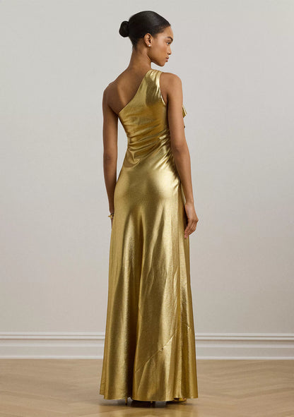 Luxurious one shoulder metallic evening gown with bow detail and floor-length skirt