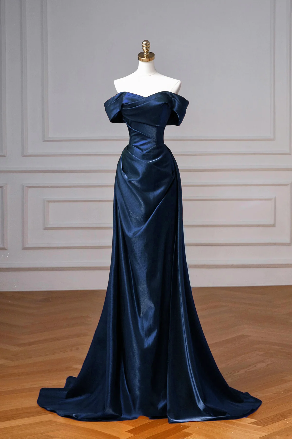 Regal satin ball-gown prom dress with off-shoulder neckline and corset back.