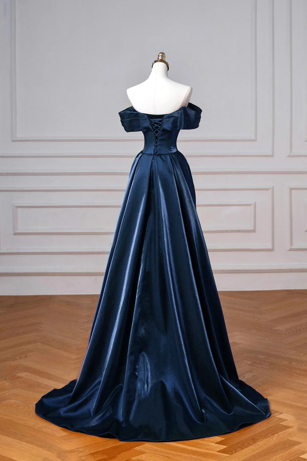 Back view of regal satin ball-gown prom dress showing corset lacing.