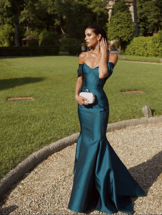 Model wearing a regal teal satin mermaid prom dress with off-shoulder sweetheart neckline and corset detail.