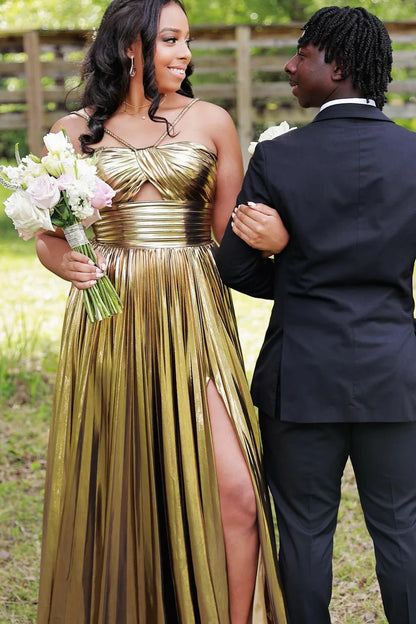 Shimmering metallic dress with pleated waist and flowing skirt.