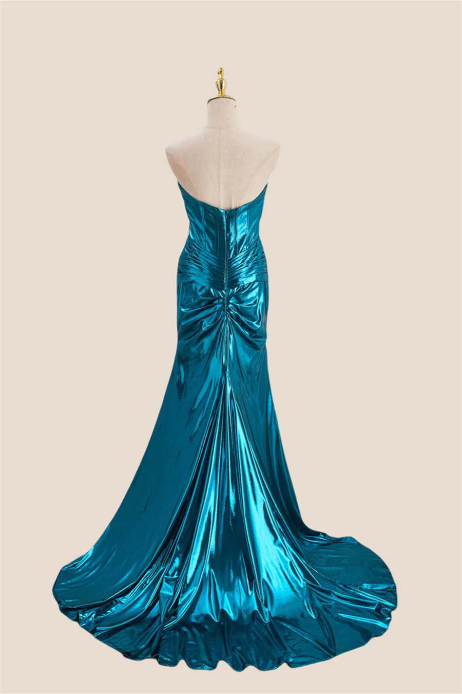 Full length view of model wearing shiny metallic mermaid formal dress.