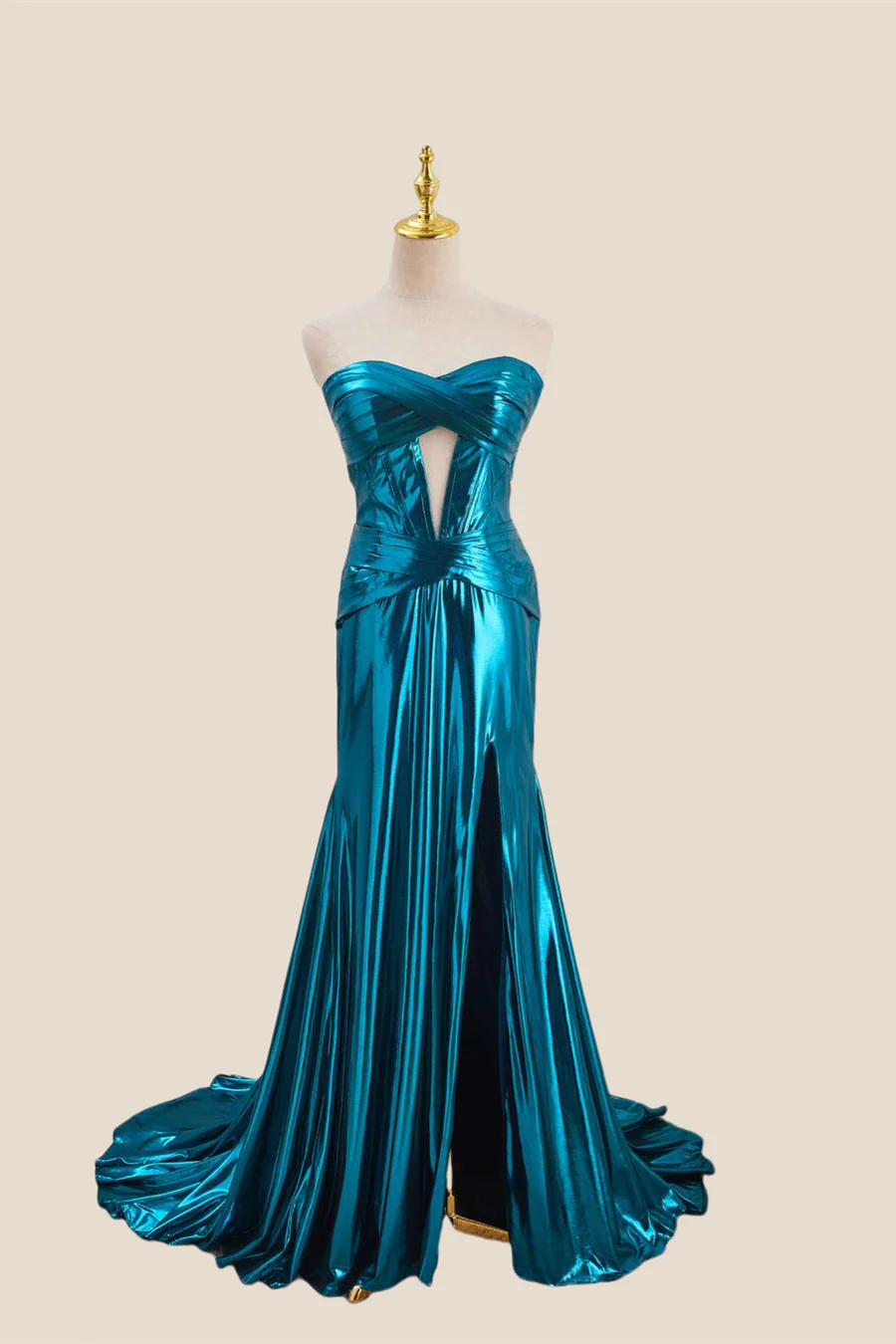 Close-up of metallic fabric and keyhole detail on evening gown.